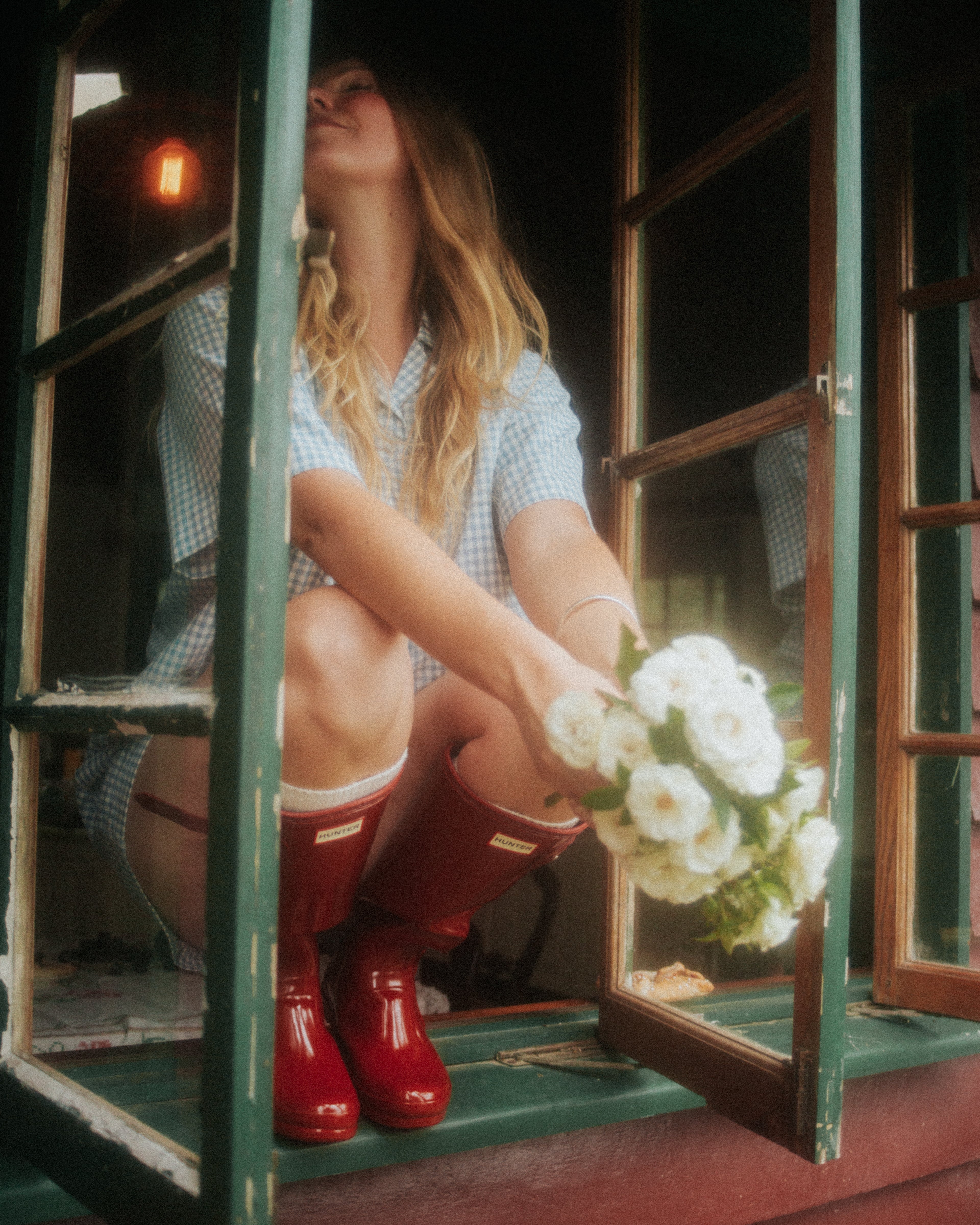 Woman Wearing the Blue Wren gingham pyjama set by Simply Provincial, handmade from 85 percent cotton and 15 percent linen. Inspired by the delicate Australian Blue Wren bird and crafted for comfort and timeless slow-fashion style. 